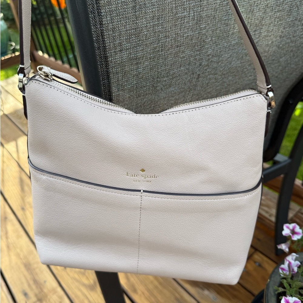 Kate Spade Cream Crossbody Bag with Minimalist Design